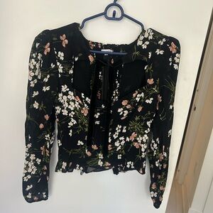 Reformation ladies black blouse with floral detail and neck tie.  size 4